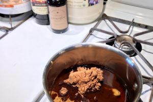 Cocoa powder and coconut oil combined in a pot