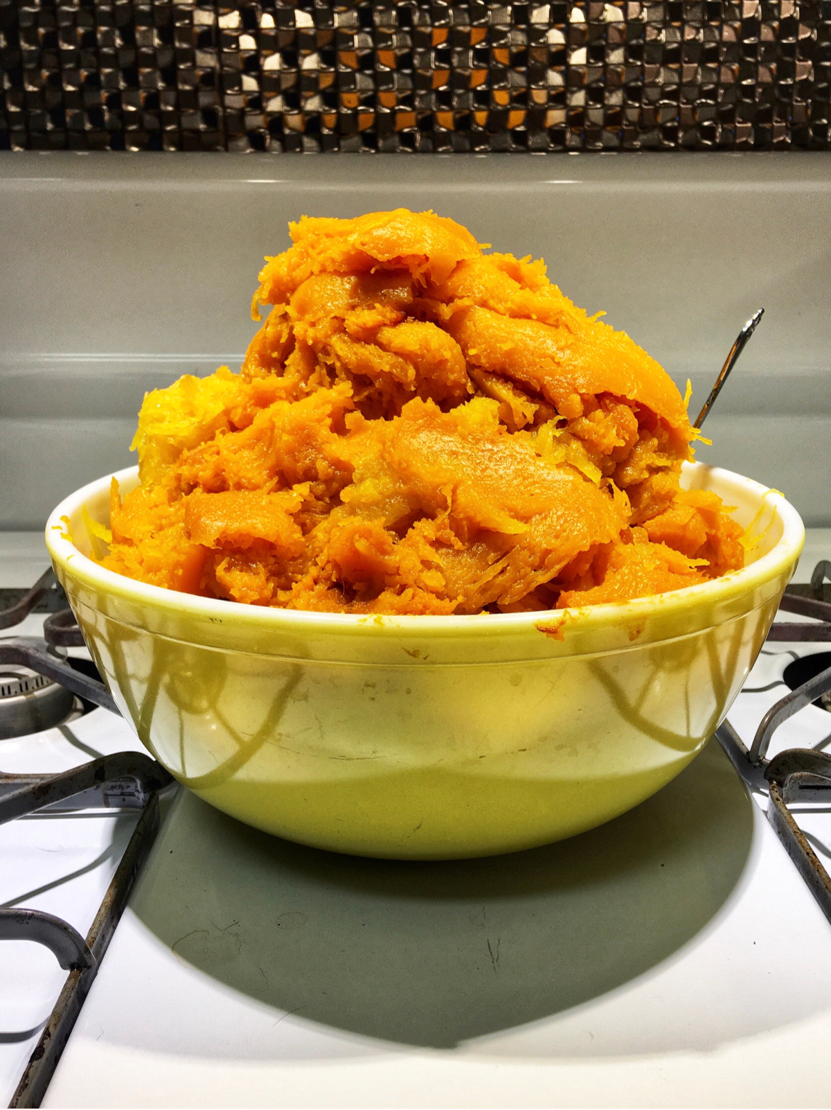 cooked pumpkin in a yellow bowl