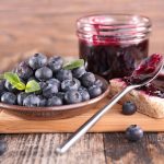 Blueberries and blueberry jam with bread
