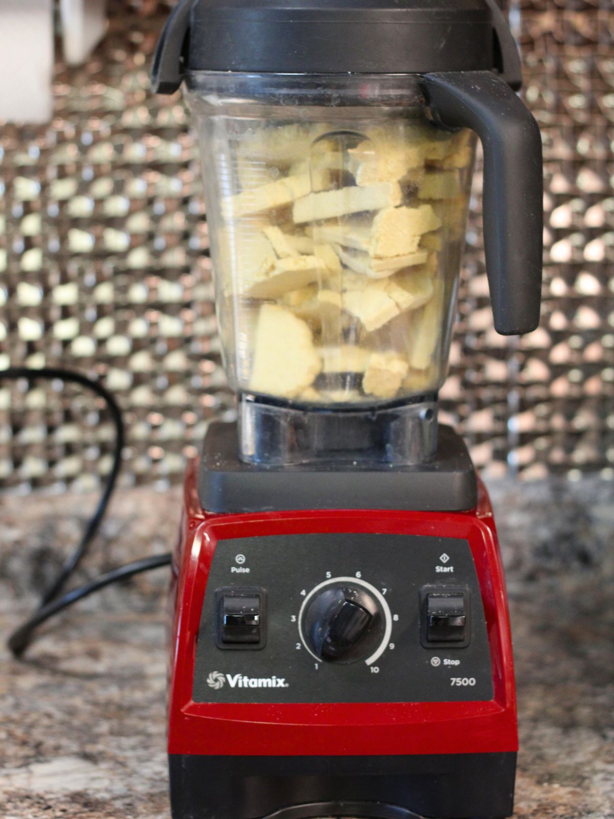 Red Vitamix blender with freeze dried pancake batter